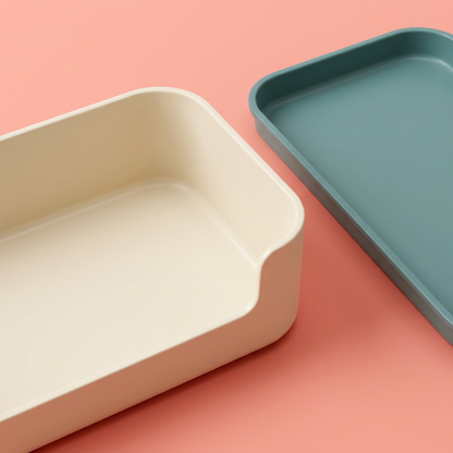 Close-up of solid-floor ivory caddy, lowered front lip and separate shallow teal tray