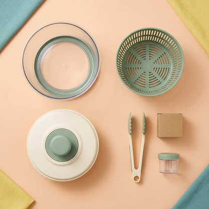Overhead concept layout showing outer bowl, slotted basket, pump-style lid, tongs and dressing cup