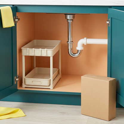 Under-sink placement concept showing organizer beside plumbing with clearance