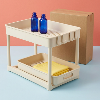 Two-tier organizer styled with empty decorative blue bottles and folded cloth, props excluded